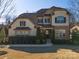 Two-story home with brick and siding accents, landscaping, and a large front yard at 680 Chase Ct, Fort Mill, SC 29708