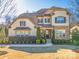 Charming two-story home with a manicured lawn and professionally landscaped front yard at 680 Chase Ct, Fort Mill, SC 29708