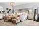 Luxurious main bedroom with king-size bed, plush seating and large windows at 680 Chase Ct, Fort Mill, SC 29708