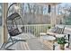 Relaxing screened porch with hanging chair and outdoor seating at 680 Chase Ct, Fort Mill, SC 29708