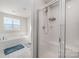 Bathroom features a soaking tub and a walk-in shower at 7067 Waterwheel Sw St, Concord, NC 28025