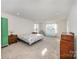 Spacious bedroom with a large bed, and plenty of room for furniture at 7067 Waterwheel Sw St, Concord, NC 28025