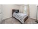 Charming bedroom with a double bed and window at 7067 Waterwheel Sw St, Concord, NC 28025