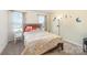 Cozy bedroom with double bed and whimsical decor at 7067 Waterwheel Sw St, Concord, NC 28025