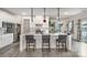 Modern kitchen with white cabinets, center island, and stainless steel appliances at 7067 Waterwheel Sw St, Concord, NC 28025