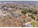 Wide aerial view showing the house and neighborhood with surrounding trees at 7137 Windyrush Rd, Charlotte, NC 28226