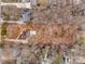 Aerial view showing house location and lot size on a tree-lined street at 7137 Windyrush Rd, Charlotte, NC 28226