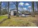 Private backyard with deck and wooded surroundings at 7137 Windyrush Rd, Charlotte, NC 28226