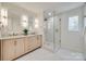 Elegant bathroom with double vanity, a large shower, and marble floors at 7137 Windyrush Rd, Charlotte, NC 28226