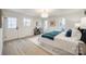 Bright bedroom with wood floors, large windows, and a spacious layout at 7137 Windyrush Rd, Charlotte, NC 28226