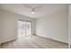 Bedroom with sliding glass doors leading to a balcony at 7137 Windyrush Rd, Charlotte, NC 28226