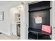 Stylish closet with black shelving and built-in wine cooler at 7137 Windyrush Rd, Charlotte, NC 28226