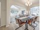 Bright dining area with arched entry and view into the living room at 7137 Windyrush Rd, Charlotte, NC 28226