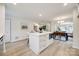 Updated kitchen with white cabinetry and a large island with seating at 7137 Windyrush Rd, Charlotte, NC 28226