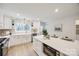 Modern kitchen featuring white cabinets, quartz countertops, and island at 7137 Windyrush Rd, Charlotte, NC 28226