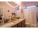 Well-appointed bathroom with double sinks and granite countertops at 7236 Albemarle Dr, Denver, NC 28037