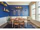 Farmhouse-style dining room with blue walls and a wooden table at 7236 Albemarle Dr, Denver, NC 28037