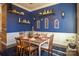 Farmhouse-style dining room with blue walls and a wooden table at 7236 Albemarle Dr, Denver, NC 28037