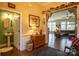 Entryway with view into living room, powder room, and hardwood floors at 7236 Albemarle Dr, Denver, NC 28037