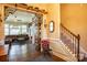 Entryway with hardwood floors, staircase, and view of living room at 7236 Albemarle Dr, Denver, NC 28037