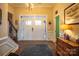 Bright entryway with hardwood floors, double door entry and staircase at 7236 Albemarle Dr, Denver, NC 28037