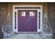 Purple double front doors with sidelights and hanging chairs at 7236 Albemarle Dr, Denver, NC 28037