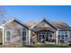 Gray house exterior with a covered patio and landscaped yard at 7236 Albemarle Dr, Denver, NC 28037