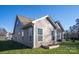 Gray siding house exterior with large windows and a covered patio at 7236 Albemarle Dr, Denver, NC 28037