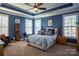 Spacious main bedroom with blue walls and a ceiling fan at 7236 Albemarle Dr, Denver, NC 28037