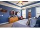 Main bedroom with blue walls, large bed and dresser at 7236 Albemarle Dr, Denver, NC 28037