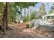 View of the spacious backyard with a storage shed, accessible from the deck via brick steps at 761 Summerwood Dr, Rock Hill, SC 29732