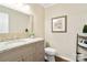 Well-lit bathroom featuring a granite countertop, a mirror, and neutral wall color at 761 Summerwood Dr, Rock Hill, SC 29732