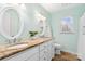 Bright bathroom featuring double sinks, granite countertops, and a window at 761 Summerwood Dr, Rock Hill, SC 29732