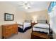 Bright bedroom featuring two beds, hardwood furnishings, and window views at 761 Summerwood Dr, Rock Hill, SC 29732