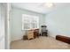 Bedroom with a large window, wood desk, and neutral carpeting at 761 Summerwood Dr, Rock Hill, SC 29732