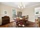 Dining room with hardwood floors, classic furniture, and a bright chandelier at 761 Summerwood Dr, Rock Hill, SC 29732