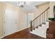 Warm foyer showcasing hardwood floors, a staircase with decorative railing, and a front door at 761 Summerwood Dr, Rock Hill, SC 29732