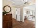 Inviting foyer featuring hardwood floors, elegant lighting, and a glimpse into the spacious living room at 761 Summerwood Dr, Rock Hill, SC 29732