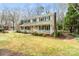 A charming two-story home featuring a wide front porch, a lush green lawn, and mature trees at 761 Summerwood Dr, Rock Hill, SC 29732