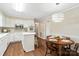 Modern eat-in kitchen with white cabinetry, stainless steel appliances, and hardwood floors at 761 Summerwood Dr, Rock Hill, SC 29732