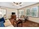 Inviting living room with wood-look floors, comfortable seating, and ample natural light at 761 Summerwood Dr, Rock Hill, SC 29732