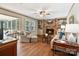 Cozy living room featuring a brick fireplace, built-in shelves, and wood-look floors at 761 Summerwood Dr, Rock Hill, SC 29732