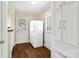 Functional mudroom featuring hardwood floors, built-in cabinets, and exterior access at 761 Summerwood Dr, Rock Hill, SC 29732