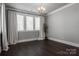 Spacious bedroom with dark hardwood floors and neutral walls at 7908 Rea View Ct, Charlotte, NC 28226