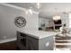 Modern kitchen island with built-in microwave and quartz countertop at 7908 Rea View Ct, Charlotte, NC 28226