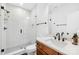 Modern bathroom with herringbone tile shower and updated vanity at 832 Heather Ln, Charlotte, NC 28209