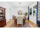 Formal dining room with chandelier, hardwood floors and built-in shelving at 832 Heather Ln, Charlotte, NC 28209