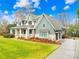 Two-story home with large yard and driveway at 832 Heather Ln, Charlotte, NC 28209