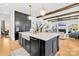 Spacious kitchen with island, white quartz countertops, and dark cabinetry at 832 Heather Ln, Charlotte, NC 28209