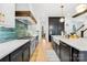 Modern kitchen features teal tile backsplash and stainless steel appliances at 832 Heather Ln, Charlotte, NC 28209